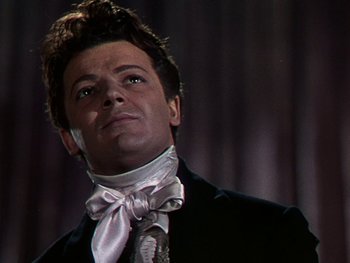 Movie still from “A Song to Remember” (1945), directed by Charles Vidor – A person wearing a suit and tie; Close Up shot, Low angle