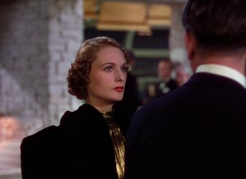 Movie still from “A Star Is Born” (1937), directed by Victor Fleming – A woman in a black jacket and a man in a suit; Close Up shot, Over the shoulder angle