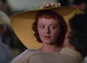 Movie still from “A Star Is Born” (1937), directed by Victor Fleming – A person wearing a hat; Close Up shot, Over the shoulder angle