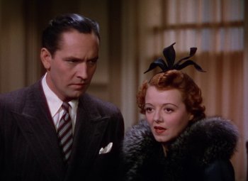 Movie still from “A Star Is Born” (1937), directed by Victor Fleming – A man and a woman standing next to each other; Close Up shot, Low angle