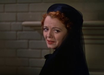 Movie still from “A Star Is Born” (1937), directed by Victor Fleming – A woman in a black dress and a black veil; Close Up shot, High angle