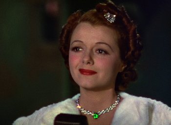 Movie still from “A Star Is Born” (1937), directed by Victor Fleming – A person wearing a necklace; Close Up shot, Low angle