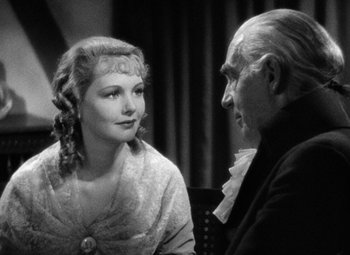 Movie still from “A Tale of Two Cities” (1935), directed by Jack Conway – An old photo of a man and a woman talking; Close Up shot, Over the shoulder angle