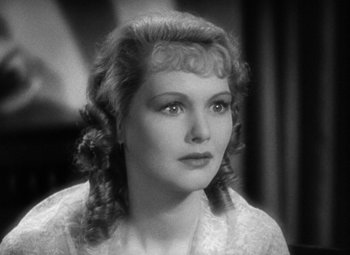 Movie still from “A Tale of Two Cities” (1935), directed by Jack Conway – A black and white photo of a woman with long hair; Close Up shot, Over the shoulder angle