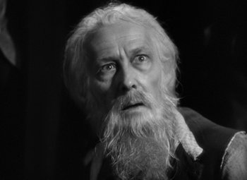 Movie still from “A Tale of Two Cities” (1935), directed by Jack Conway – An old man with long white hair and a long beard; Close Up shot, Low angle