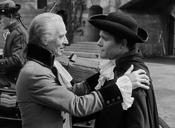 Movie still from “A Tale of Two Cities” (1935), directed by Jack Conway – A man and a woman embracing each other outside; Medium shot, Over the shoulder angle
