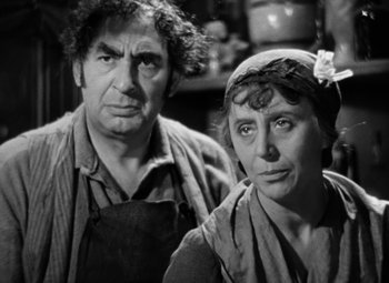 Movie still from “A Tale of Two Cities” (1935), directed by Jack Conway – A man and a woman standing next to each other; Close Up shot, High angle