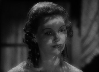 Movie still from “A Tale of Two Cities” (1935), directed by Jack Conway – A black and white photo of a woman with long hair; Close Up shot, High angle