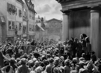 Movie still from “A Tale of Two Cities” (1935), directed by Jack Conway – A crowd of people gathered in an open area; Extreme Wide shot, High angle
