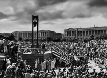 Movie still from “A Tale of Two Cities” (1935), directed by Jack Conway – A crowd of people gathered in a large open area; Extreme Wide shot, High angle