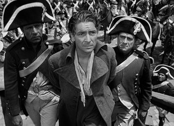 Movie still from “A Tale of Two Cities” (1935), directed by Jack Conway – A group of men in old - fashioned military garb; Medium shot, High angle