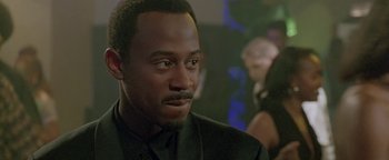 A person wearing a suit and tie