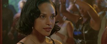 A woman's face in front of a group of people