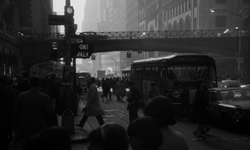 Movie still from “A Thousand Clowns” (1965), directed by Fred Coe – A black - and - white photo of people walking on a busy street; Extreme Wide shot, High angle