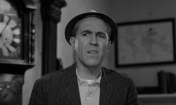 Movie still from “A Thousand Clowns” (1965), directed by Fred Coe – A black and white photo of a man wearing a hat; Close Up shot, High angle