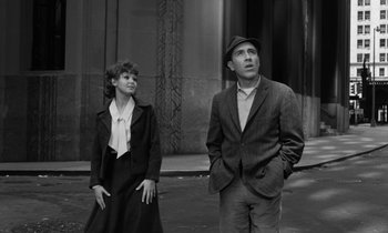 Movie still from “A Thousand Clowns” (1965), directed by Fred Coe – A man and a woman standing next to each other on the sidewalk; Medium shot, Low angle