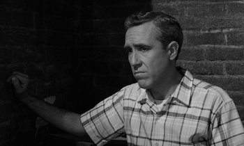 Movie still from “A Thousand Clowns” (1965), directed by Fred Coe – A black and white photo of a man in a plaid shirt; Close Up shot, High angle