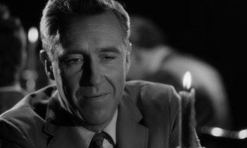 Movie still from “A Thousand Clowns” (1965), directed by Fred Coe – A black and white photo of a man in a suit and tie; Close Up shot, Over the shoulder angle