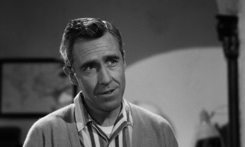 Movie still from “A Thousand Clowns” (1965), directed by Fred Coe – Black and white photograph of a man looking at the camera; Close Up shot, Over the shoulder angle