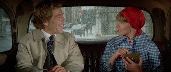 Movie still from “A Touch of Class” (1973), directed by Melvin Frank – A man and a woman sitting in the back of a car; Medium shot, Over the shoulder angle