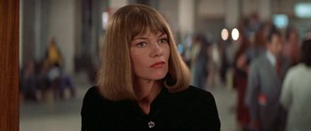 Movie still from “A Touch of Class” (1973), directed by Melvin Frank – A person wearing a black jacket; Close Up shot, Low angle