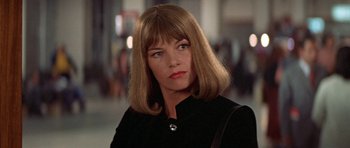 Movie still from “A Touch of Class” (1973), directed by Melvin Frank – A person wearing a black shirt; Close Up shot, Over the shoulder angle