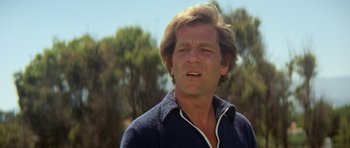 Movie still from “A Touch of Class” (1973), directed by Melvin Frank – A person wearing a sweater; Close Up shot, Low angle