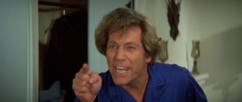 Movie still from “A Touch of Class” (1973), directed by Melvin Frank – A person with a hand gesture; Close Up shot, Low angle