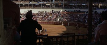 Movie still from “A Touch of Class” (1973), directed by Melvin Frank – A crowd of people in a stadium watching a show; Extreme Wide shot, High angle