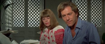 Movie still from “A Touch of Class” (1973), directed by Melvin Frank – A man and a woman sitting next to each other; Close Up shot, Low angle