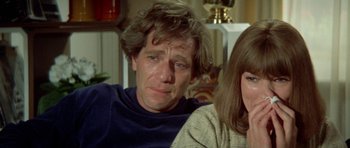 Movie still from “A Touch of Class” (1973), directed by Melvin Frank – A person sitting next to another person; Close Up shot, Over the shoulder angle