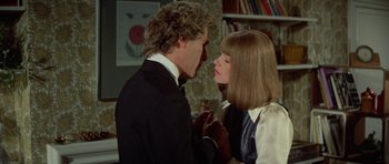 Movie still from “A Touch of Class” (1973), directed by Melvin Frank – A man and a woman are kissing in a room; Close Up shot, Over the shoulder angle