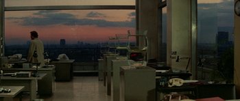 Movie still from “A Touch of Class” (1973), directed by Melvin Frank – A room with a view of a city at sunset; Extreme Wide shot, High angle
