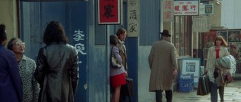 Movie still from “A Touch of Class” (1973), directed by Melvin Frank – A man and a woman standing next to each other on the street; Wide shot, High angle