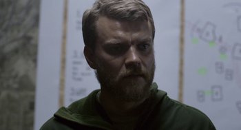 Movie still from “A War” (2015), directed by Tobias Lindholm – A person with a beard; Close Up shot, Over the shoulder angle