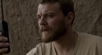 Movie still from “A War” (2015), directed by Tobias Lindholm – A person with a beard; Close Up shot, Over the shoulder angle