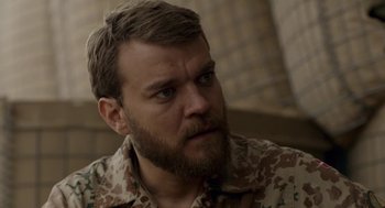 Movie still from “A War” (2015), directed by Tobias Lindholm – A person with a beard; Close Up shot, Over the shoulder angle