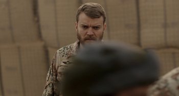 Movie still from “A War” (2015), directed by Tobias Lindholm – A person with a beard; Close Up shot, Over the shoulder angle
