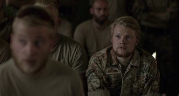 Movie still from “A War” (2015), directed by Tobias Lindholm – A group of men sitting next to each other in a room; Close Up shot, Over the shoulder angle