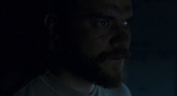 Movie still from “A War” (2015), directed by Tobias Lindholm – A person with a beard; Close Up shot, Over the shoulder angle