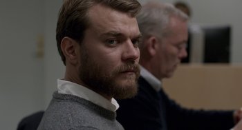 Movie still from “A War” (2015), directed by Tobias Lindholm – A man with a goatee and a beard; Close Up shot, Over the shoulder angle