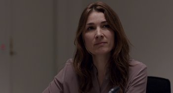 Movie still from “A War” (2015), directed by Tobias Lindholm – A person sitting at a table; Close Up shot, Over the shoulder angle