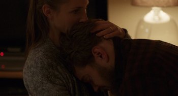 Movie still from “A War” (2015), directed by Tobias Lindholm – A man and a woman are cuddling in a room; Close Up shot, Over the shoulder angle