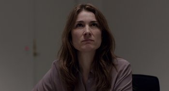 Movie still from “A War” (2015), directed by Tobias Lindholm – A person with long brown hair; Close Up shot, Low angle