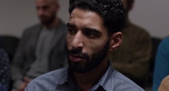 Movie still from “A War” (2015), directed by Tobias Lindholm – A person with a beard; Close Up shot, Over the shoulder angle
