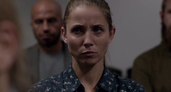 Movie still from “A War” (2015), directed by Tobias Lindholm – A person wearing a floral shirt; Close Up shot, Over the shoulder angle