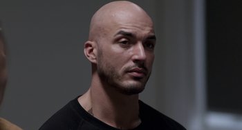 Movie still from “A War” (2015), directed by Tobias Lindholm – A man with a shaved head and a beard; Close Up shot, High angle