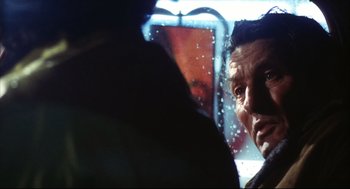 Movie still from “A Woman Under the Influence” (1974), directed by John Cassavetes – A person looking at the camera; Close Up shot, Over the shoulder angle