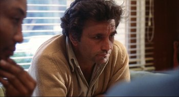 Movie still from “A Woman Under the Influence” (1974), directed by John Cassavetes – A person wearing a sweater; Close Up shot, Low angle