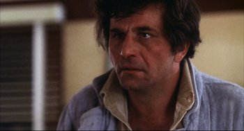 Movie still from “A Woman Under the Influence” (1974), directed by John Cassavetes – A person wearing a shirt; Close Up shot, Low angle